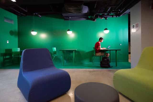 A student studies in a common area in Kacek Hall